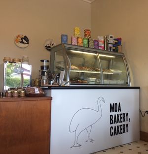 The cabinet with the delicious food - top shelf sweets, bottom shelf savory goodies at MOA Bakery Cakery in Oamaru