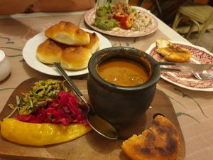 Bean pot, corn bread, regular bread and vegan pate plate at Palaty in Kutaisi
