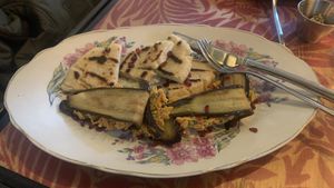 Fried eggplants made with a spicy walnut paste, fried eggplant, corn bread, and tahini cream.   at Kafe Leila in Tbilisi