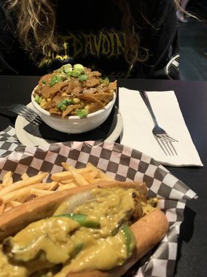 Philly cheezesteak sandwich and Mac N Cheeze with extra seitan.   at Black Water Bar in Portland