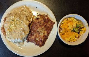 Beyond chicken fried steak with country gravy, hash browns, and scrambled JUST Egg with cheddar at Black Water Bar in Portland