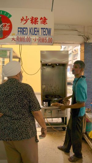 Char Koay Teow preparation. at Blue Boy Vegetarian Food Centre in Kuala Lumpur