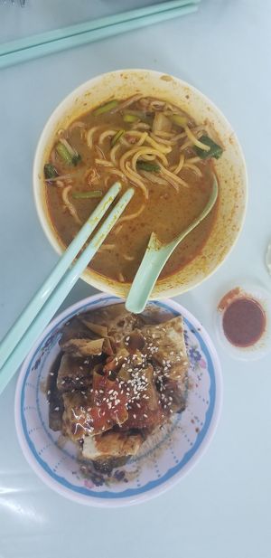 Laksa and assorted pieces at Blue Boy Vegetarian Food Centre in Kuala Lumpur