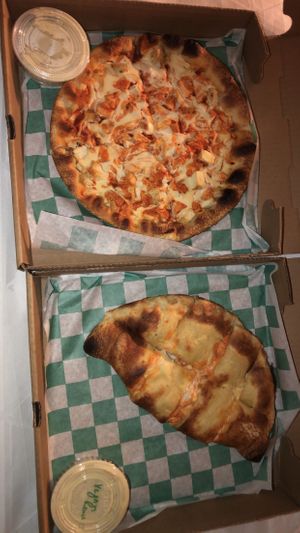 Vegan buffalo chicken pizza and calzone & vegan ranch  at Pizza & Sub Stop in Lowell
