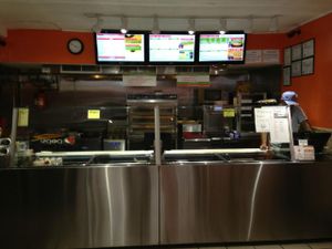 Open kitchen serving row at Pizza & Sub Stop in Lowell