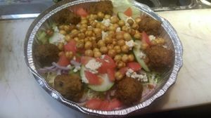 Vegan Falafel Salad with Home made Falafel, Vegan Feta and Spiced beans on top with veggies. at Pizza & Sub Stop in Lowell