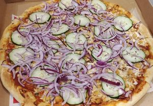 Vegan Chhole Pizza: Chhole curry on pizza with Vegan Cheese topped with Onions and Cucumbers. at Pizza & Sub Stop in Lowell