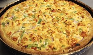 Vegan Tikka Chicken Masala Pizza: Vegan Tikka masala sauce with Green Pepper, Onions, Vegan Chicken, Green Peppers, Onions and Vegan Cheese.	 at Pizza & Sub Stop in Lowell