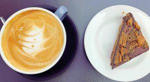Lovely vegan biscotti cake and almond cappuccino  at Sala Cafe & Bar in Colchester