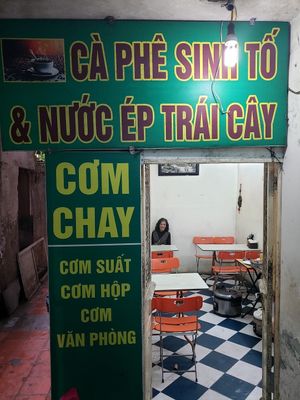 The restaurant with the proprietor. She doesn't speak English but she is friendly and has a warm smile. at Tu Hao in Hanoi