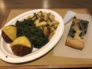 Quinoa muffins, spinach pearl cous cous, roast rosemary potatoes and spinach pizza at Radicetonda - Piazza Buozzi in Milan