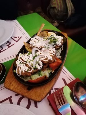 Potatoes with vegan cheese and mayo at Veg World India in Barcelona