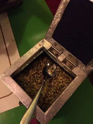 decorated metal box with inside many digestive mixed seeds at Veg World India in Barcelona