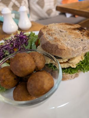 Hummus sandwich w/ vegan bread and falafel at Ambient Cafe  in Thimphu