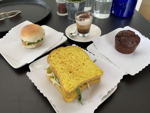 Delicious sandwiches, chocolate muffin and espresso! at 100% Bio in Rome