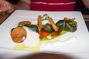 Mangold roulades filled with feta cheese, accompanied by hash browns and pepper (vegetarian) at Herzenslust in Saarbrucken