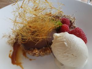 Chocolate and ganache tart with a mixed nut and date base, salted caramel, spun sugar and vanilla ice cream. One of the best desserts I've ever eaten. at Rootcandi in Brighton