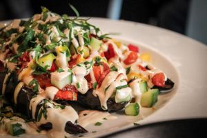 vegan aubergine with tahini sauce and vegetables at Aubergine in Bucharest