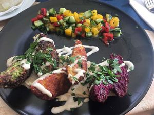 Three colored falafel with tahini sauce! Beetroot, sweet potatoes and herbs, really good!  at Aubergine in Bucharest
