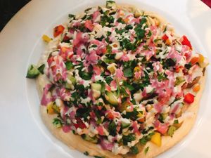 aubergine cubes on a hummus base with beetroot and tahini dressing.  at Aubergine in Bucharest