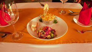 Freshly made vegan sausages served with creamy French-style mashed potato and dressed salad, a design your own gratin (vegan or with cheese!), and homemade tofu served with Shimeji and Enoki mushrooms are just some of the Creole inspired dishes Georges offers our vegan and vegetarian guests.  at Georges Rhumerie in Siem Reap