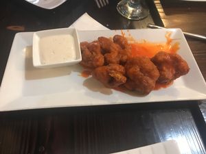 Buffalo cauliflower wings with cashew ranch  at 3 Brothers Vegan Cafe in Copiague