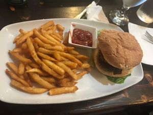 Bacon cheeseburger with fries at 3 Brothers Vegan Cafe in Copiague