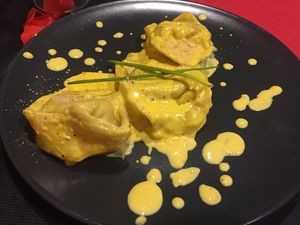 St Valentine's menu, first course: tortelli di  carciofi e patate con crema allo zafferano (artichokes and potatoes tortelli with saffron cream) at Lizard in Rome
