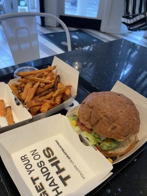 Guac burger + sweet potato fries  at Beatnic - Bleecker St in New York City