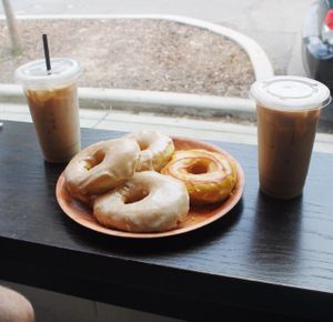 Plate of donuts and almond milk lattes at Vortex Doughnuts in Asheville
