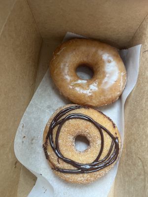 2 yeast donuts: “vanilla” glazed (top) “vortex” cinnamon sugar and chocolate swirl (bottom)  at Vortex Doughnuts in Asheville