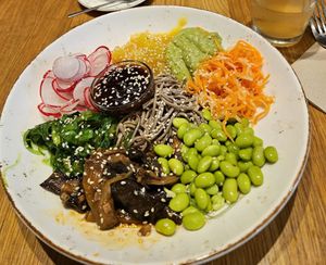 Poke bowl with eggplant, carrot, mango chutney, radish, edamame, and soba noodles at Beet in Luxembourg City