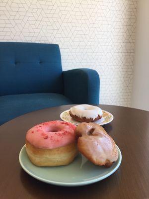 Strawberry doughnut & apple fritter with lemon curd doughnut in the background. at The Big O Doughnuts in Salt Lake City