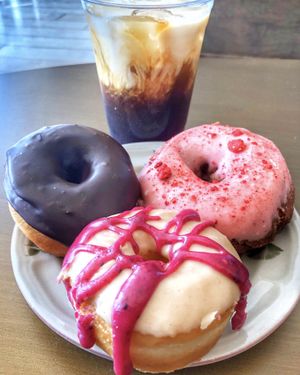 Chocolate, strawberry cake, and PB&J doughnuts with an iced latte at The Big O Doughnuts in Salt Lake City