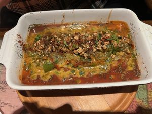 Homemade seitan in vegetable gravy topped with roasted tofu chunks  at Karuzo in Sarajevo