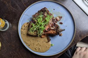 Aubergine vegan schnitzel met pepersaus at Eetcafe Spinoza in Leeuwarden