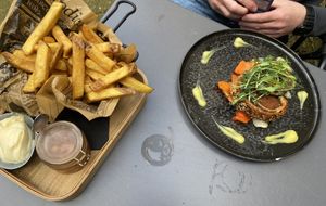 Seitan Wellington: tasty, but the structure wasn’t that meaty. The portion of fries was huge and came with mayo and very tasty apple compote. at Eetcafe Spinoza in Leeuwarden