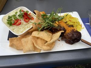 Vegan saté: nice, but too salty. The (homemade?) cassave crackers were the star of the show!  at Eetcafe Spinoza in Leeuwarden