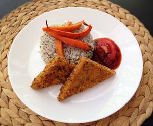 Burmese fried chickpea slices with tomato chutney, jasmine rice and roasted carrots at RepaRetek in Budapest
