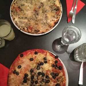 White four cheese pizza and olive and artichoke pizza at NovaPizza Vegan Kitchen in Edinburgh