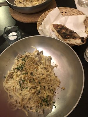 Spaghetti carbonara with bread  at NovaPizza Vegan Kitchen in Edinburgh