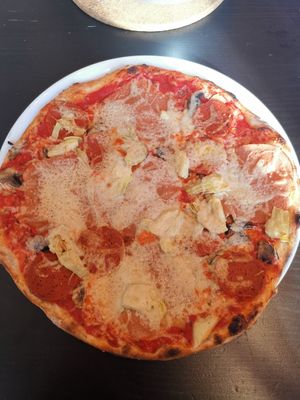 Pizza with ham, pepperoni, artichoke at NovaPizza Vegan Kitchen in Edinburgh