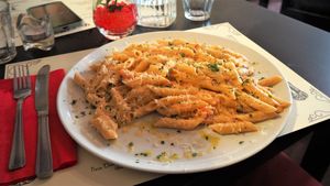 Vegan Penne Al Salmone [£13.90] – Penne cooked in a creamy sauce with garlic, cherry tomatoes, soy cream and vegan salmon topped with fresh parsley and vegan parmesan at NovaPizza Vegan Kitchen in Edinburgh