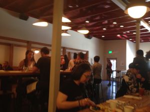 long communal tables, with a few booths at Citizen Fox - Pop up in San Francisco