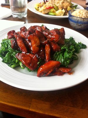 Vegan bbq ribs on top of bed of kale  at Shangri-La Vegetarian in Brooklyn