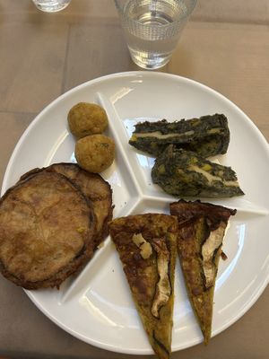 Arancini, sfrittata, fried eggplant, spinach cake  at Flora in Verona