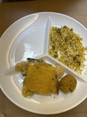 Potato gratin, rice swith peas and curry  at Flora in Verona