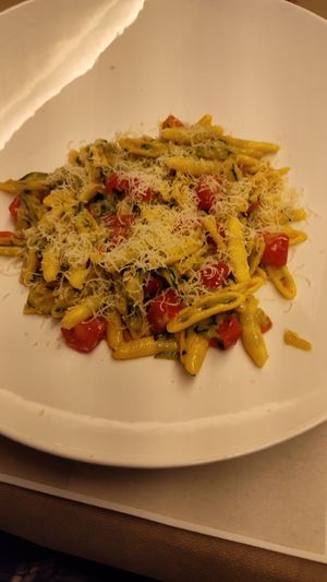 Pasta with vegan cheese and veggies. at Flora in Verona