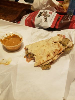 the apu (whit beans patty, pickle shreddies, spicy coleslaw, tomatoes, and served with dill tahini sauce in a pita) at Two Beards Deli in Grand Rapids