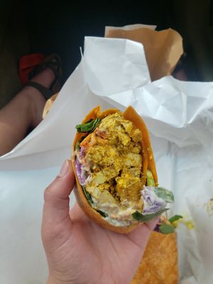 the hayao miyazaki: curried tofu, spinach, carrot, red cabbage, vegan mayo in a sundried tom wrap at Two Beards Deli in Grand Rapids